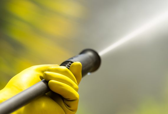 Close up of a pressure washer spraying out water